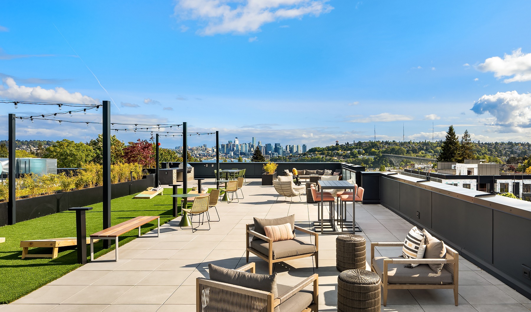 Rooftop lounge with green space and seating