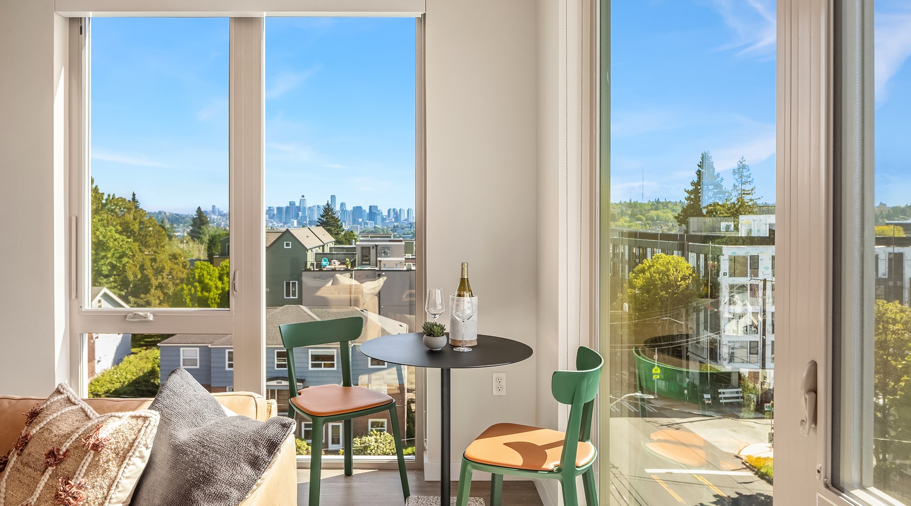 Living room with corner windows and table